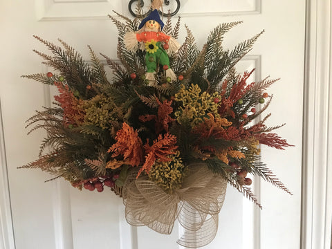 Hanging vintage basket with scarecrow