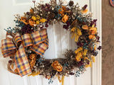 Bronze leaves, gold ranaculus and blueberries