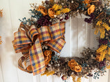 Bronze leaves, gold ranaculus and blueberries