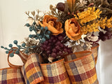 Bronze leaves, gold ranaculus and blueberries