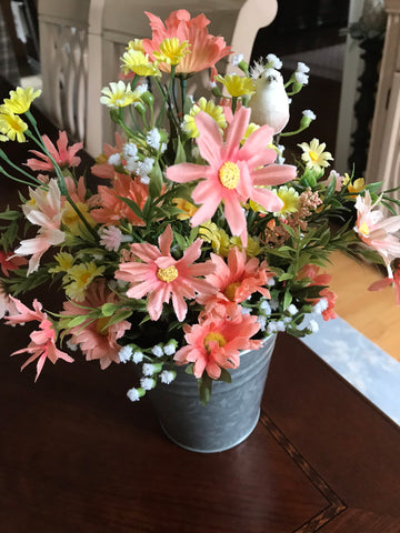 Daisies with a baby bird