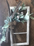 Antique window with lambs ear, cotton, rustic bow and real wild turkey feathers