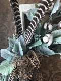 Antique window with lambs ear, cotton, rustic bow and real wild turkey feathers