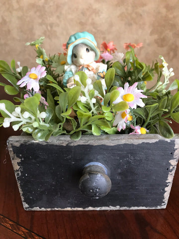 Female bunny planting carrots and beans