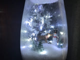 Snowman on a vase with a woodsy scene