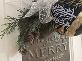 Have Yourself a Merry Little Christmas tin with a navy, gold and white ornament